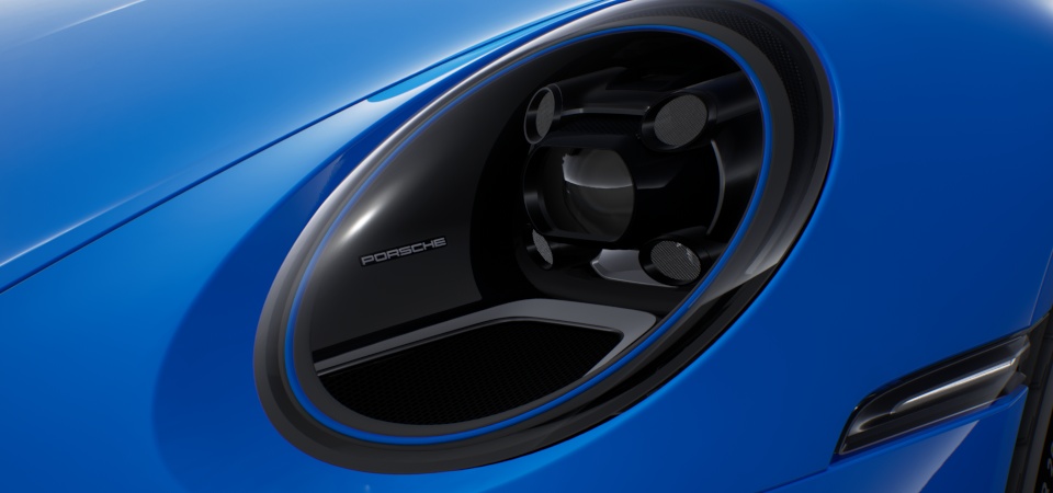 Fari principali a LED in nero con Porsche Dynamic Light System (PDLS) e anello di finitura in blu Shark