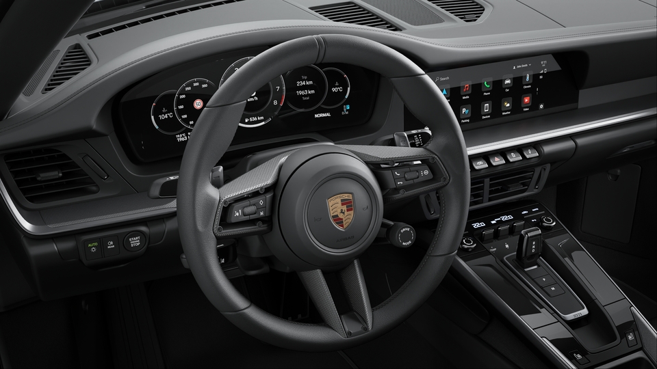 Volante esportivo GT aquecido em couro com painel do volante em carbono fosco.