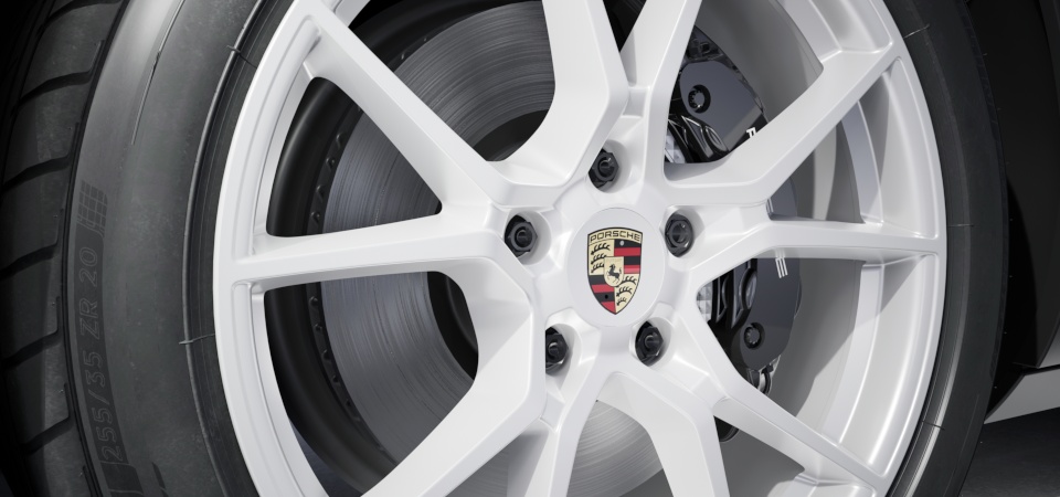Juego de centros de ruedas con escudo Porsche en color