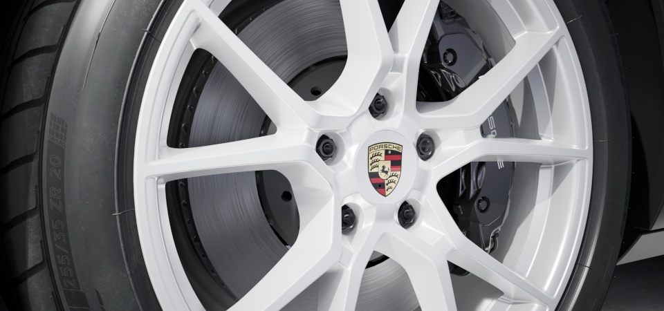 Conjunto de centros de roda com emblema completo da Porsche em cores.