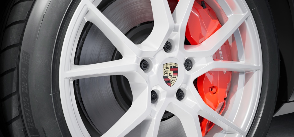 Conjunto de centros de roda com emblema completo da Porsche em cores.