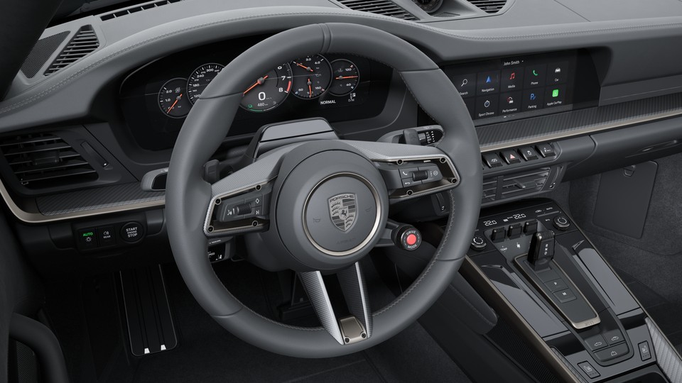 Volante deportivo GT calefactado de cuero con panel del volante en carbono mate (en combinación con el Paquete Interior Turbonite)