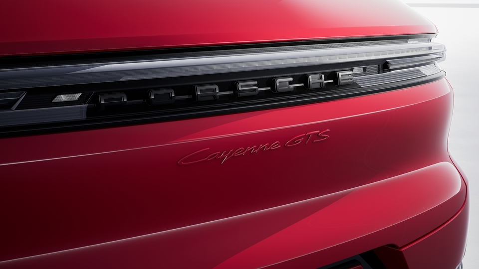 "PORSCHE" Logo in High Gloss Black and Model Designation in Exterior Color on Rear