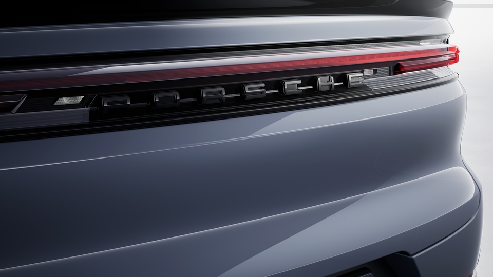 'PORSCHE' logo painted in Black (high-gloss) including deletion of model designation