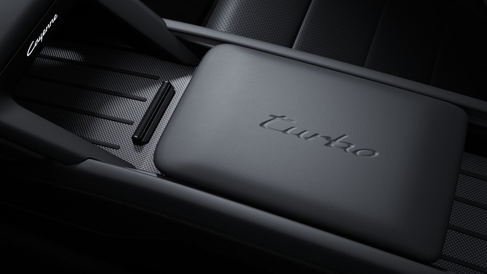 Model logo embossed on front centre console armrest